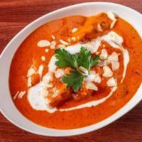 Butter Chicken · Boneless tandoori chicken cooked with butter, ginger, garlic, and tomato.