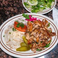 Chicken Shawarma Plate · A plateful of slowly roasted meat shavings directly from the vertical broiler, topped with f...