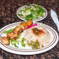 Shish Tawook Plate · Marinated chunks of chicken, skewered and charbroiled to a tender perfection.