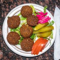 Falafel Plate · Fava beans and chickpeas mixed with fresh vegetables and fried to form a golden crispy outsi...