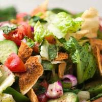 Fattoush · Romaine lettuce, tomato, onion, crisp cucumber, tossed with freshly toasted pita chips and s...