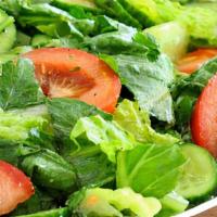 House Salad · Garden-fresh romaine lettuce, tomato, cucumber, onion,  house dressing on the side.