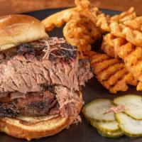 Beef Brisket Sandwich · Nothing but tender smoked brisket.  Add cheese for an additional charge.