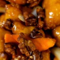 Honey Walnut Chicken · Chunks of battered chicken covered in a honey sauce and topped with walnuts.