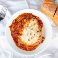 Lasagna Bolognese · Served with pasta sheets and topped with tomato cream sauce, marinara sauce, or bolognese me...