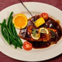 Salmon Lorenzana · Fresh fillet of salmon marinated in garlic, lemon juice, and teriyaki, then broiled to perfe...