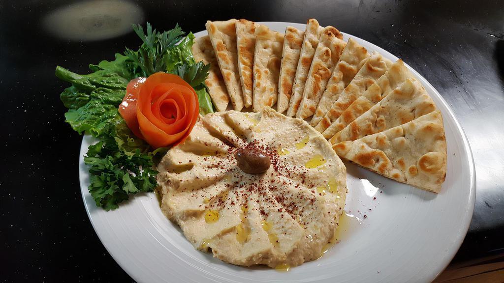 Classic Hummus  · Basil’s world famous classic hummus made from fresh chickpea’s, extra virgin olive oil, fresh garlic and tahini.