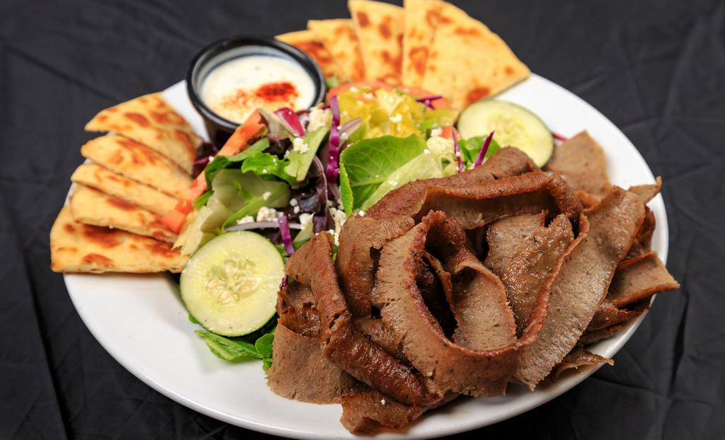 Gyros Salad  · Generous portion of grilled gyros meat with fresh greens, tomato, cucumber, unpitted calamata olives (with seeds), pepperoncini, feta cheese and warm pita bread, served with side of Basil’s tzatziki sauce and Greek dressing.
