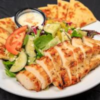 Grilled Chicken Shish Kabob Salad · Grilled to perfection house marinated chicken breast skewer served over fresh greens, tomato...