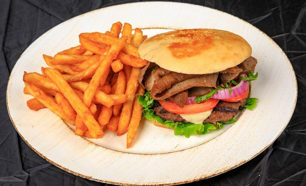 Basil’S Ultimate Burger  · Seasoned fresh ground Beef patty topped with chipotle hummus, melted swiss cheese, served on our homemade focaccia bread with lettuce, tomatoes, red onion, pickles and a generous portion of Gyro meat.