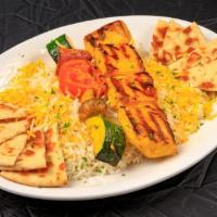 Chicken Shish Kabob · Marinated (saffron) chicken breast, charbroiled and served over steamed basmati rice (garnis...