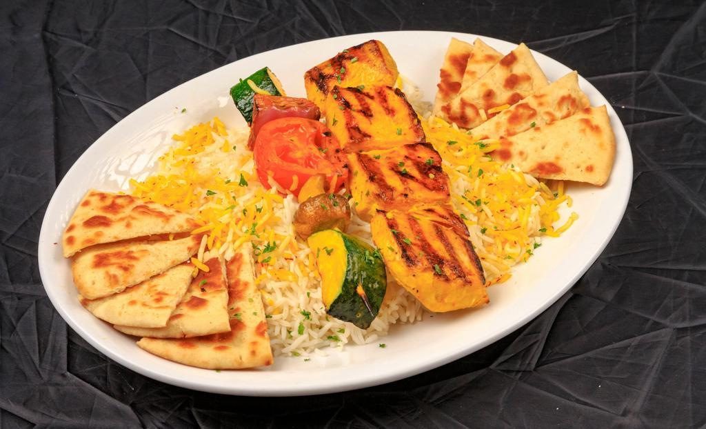 Chicken Shish Kabob · Marinated (saffron) chicken breast, charbroiled and served over steamed basmati rice (garnished with Saffron) with skewer of grilled vegetables.