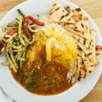 Tilapia Bandarri · Baked house marinated tilapia, topped with basil’s tomato sauce and served with grilled zucc...