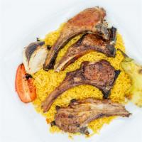 Lamb Chops · Marinated and fire-grilled tender lamb chops (4) with grilled tomatoes onion peppers, salad,...