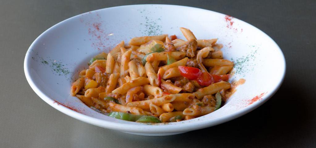 Voodoo Pasta · Chicken, Andouille sausage, shrimp, peppers, onions, spicy tomato cream sauce.