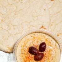 Hummus · Fresh chickpeas blended with lemon juice and various spices, then topped with olive oil, ser...