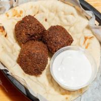 Falafel (3 Pieces) · Chickpeas mixed with parsley and Mediterranean spices. Fried golden brown served with pita.