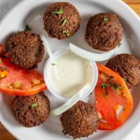 Falafel · Gluten Free. Vegan. A mixture of chickpeas, parsley, garlic, onions and spices. Made into pa...