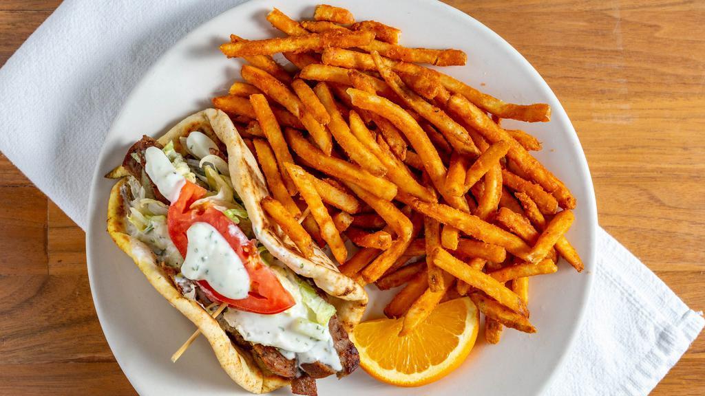Gyro Sandwich · Grilled gyro slices served in a pita pocket. With tzatziki sauce (yogurt cucumber sauce) on the side.