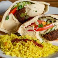 Falafel & Hummus Sandwich · Fan Favorite. Vegan. A mix of falafel and hummus stuffed in pita and topped with tahini sauce.