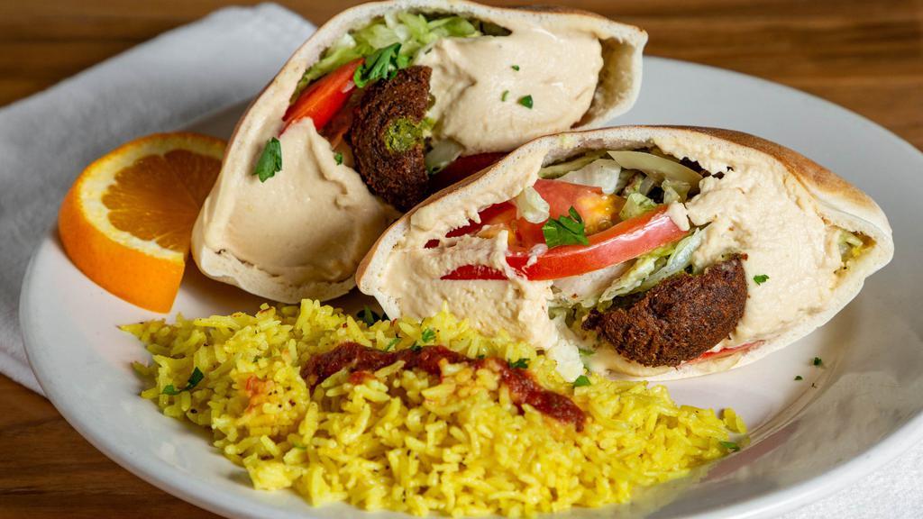 Falafel & Hummus Sandwich · Fan Favorite. Vegan. A mix of falafel and hummus stuffed in pita and topped with tahini sauce.