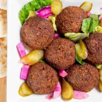 Falafel Plate · Chickpeas and fava beans ground with vegetables and spices, served with tahini sauce, tomato...