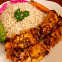 Shish Tawook · Most popular. Char broiled white meat chicken marinated in garlic sauce. Served with choice ...