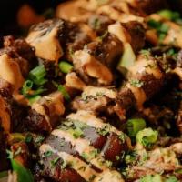 Steak Bites · Marinated tenderloin steak bites, sauteed mushrooms and onions, mixed greens, blue cheese cr...