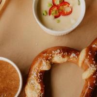 Giant Pretzel · Served with quest blanco and honey mustard.