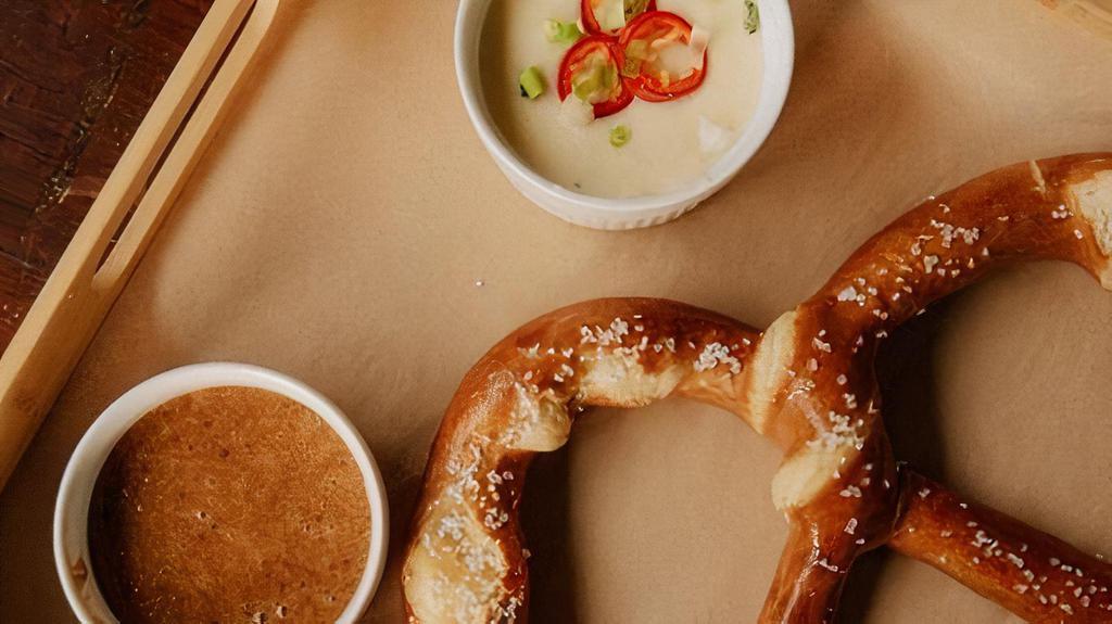 Giant Pretzel · Served with quest blanco and honey mustard.