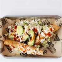 Flautas · Three (3) rolled & deep-fried tortillas filled with meat & topped with lettuce, avocado, que...
