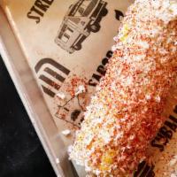 Mexican Street Corn · Corn on the cob with mayo, cheese & chili powder.