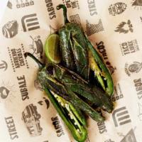 Chiles Toreados · Fried fresh jalapeños with lime juice, salt & pepper.