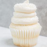 Wedding Cake · White cake topped with a vanilla buttercream frosting and sprinkled with white non-pariels.