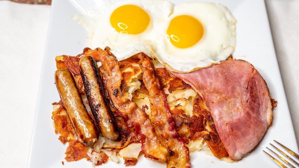 Combo Breakfast Special · Two large eggs, two slices of bacon, two sausage links, a slice of ham, and hash browns and toast.