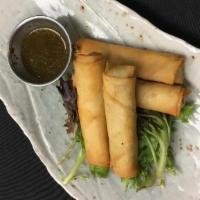 Avocado Spring Rolls · Vegetarian. Hand rolled, flaky spring roll wrappers filled with fresh avocado mix & served w...
