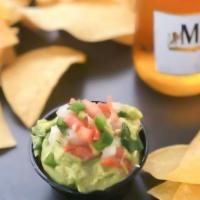 Guacamole And Chips · avocado-based dip with onion, garlic, tomato and lime juice.