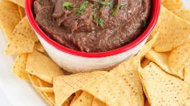 Bean Dip And Chips · refried beans baked with cheese and mild spices to create a creamy dip.