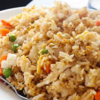 Fried Rice · Stir fried rice with eggs, peas, carrots, white onions. We CANNOT make without egg.  26 oz