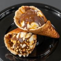 Drumsticks · Waffle cone with hard shell chocolate and caramel filled with vanilla ice cream topped with ...