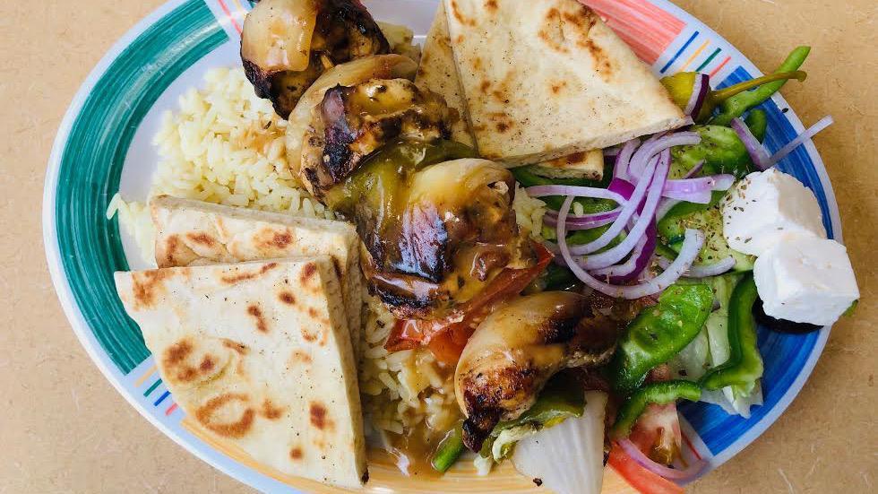 Athenian Chicken Kebab · Marinated chicken, onions, green peppers, mushrooms & tomatoes on a skewer grilled to perfection. Served with our homemade lemon sauce, rice, tzatziki sauce, pita bread & a cup of soup.