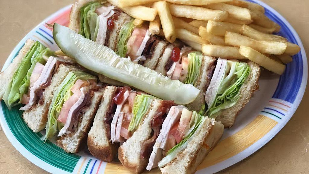 Turkey Club · Served with lettuce, tomatoes, bacon & mayo on white toast.