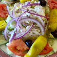 Greek Salad · Iceberg lettuce, tomatoes, cucumbers, green peppers, red onion, pepperoncini, Kalamata olive...