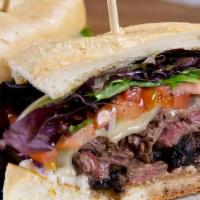Tender Filet Steak Sandwich* · Marinated filet, Monterey jack cheese, red onion, tomato, mixed greens and parmesan mayonnai...