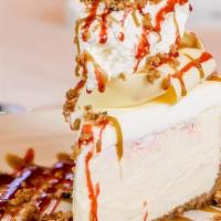 White Chocolate Raspberry Cheesecake · A creamy, soft raspberry infused cheesecake. Topped with fresh raspberries, whipped cream, a...
