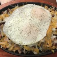 The Original Breakfast Skillet · Grilled bacon, sausage, ham, onions, green peppers, potatoes, eggs any style, and cheese lay...