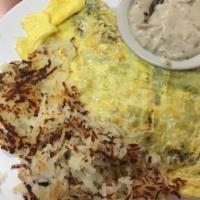 Farmer'S Omelet · Ham, bacon, onions, cheese, green pepper, hash browns, and a side of sausage gravy.