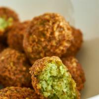 Falafel Entree · Vegetarian. Lightly fried, seasoned ground garbanzo beans with vegetables. All entrees are s...