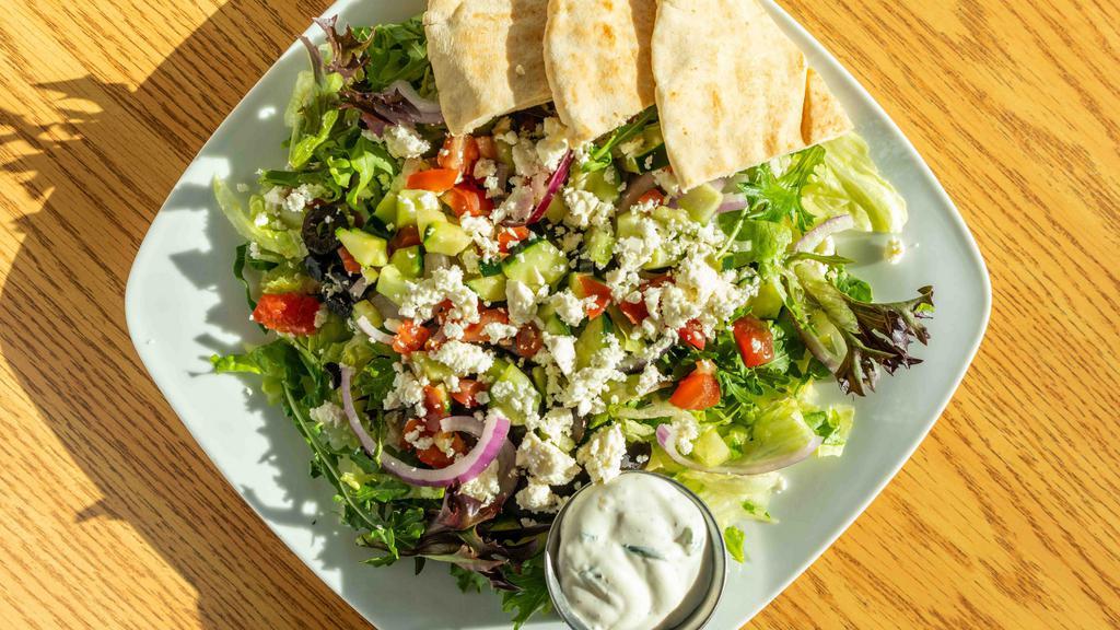 Greek Salad · Vegetarian. Lettuce, cucumber, tomato, onion, olives + feta cheese, served with tzatziki sauce.
