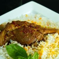 Lamb Shank Entree · Leg of lamb, simmered in rich tomato sauce, onions and spices. All entrees are served on a b...